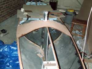 The "butterfly" in position but not yet cut out. With the foam sanded to size I need to be careful with it, but some fibreboard makes a reasonably safe surface, even for those jobs where I have to sit on the boat. Click for enlargement.